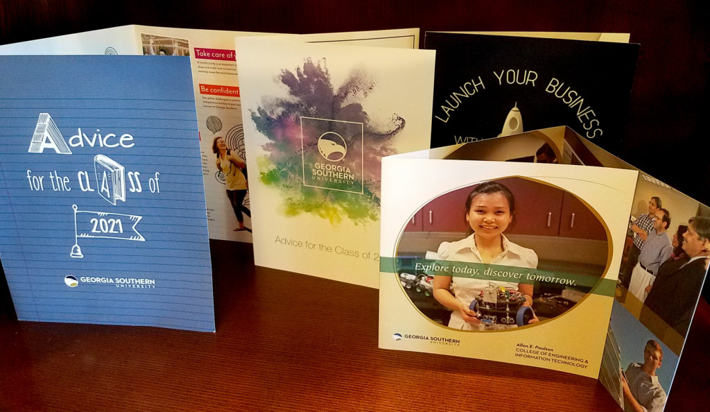 various brochures on a table